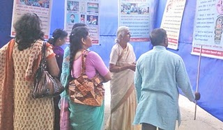 Mr. Kadam enlightening on HJS's activities to Smt. Vijaya Tai Bhosale Mr. Kadam enlightening on HJS's activities to Smt. Vijaya Tai Bhosale